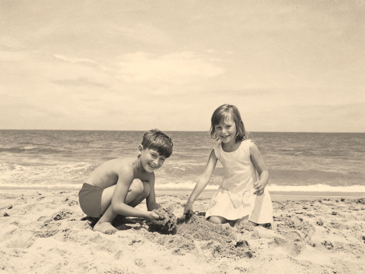 Children playing on the beach, 1960s — original black and white